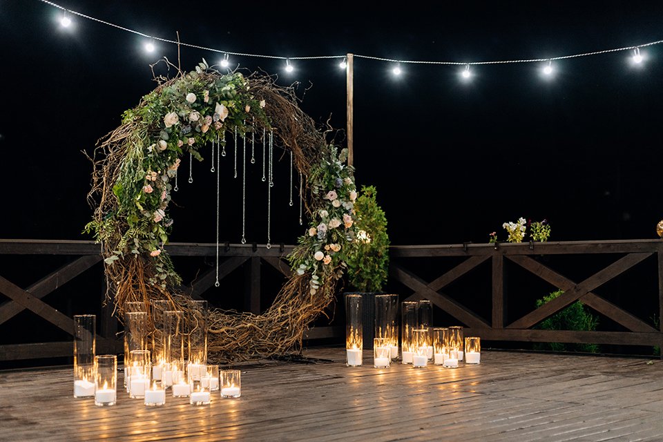 Huge decorative circle made of willow, greenery and pale orange